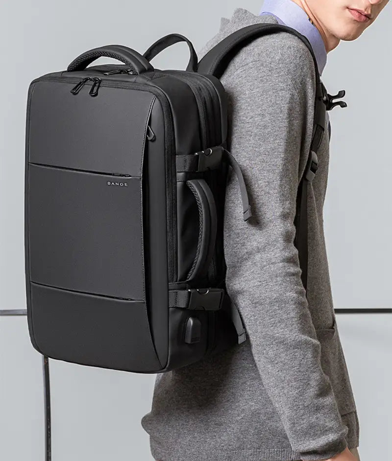 Black bangle laptop backpack with sleek minimalist design and durable fabric construction featured as a business backpack waterproof large capacity laptop bag.
