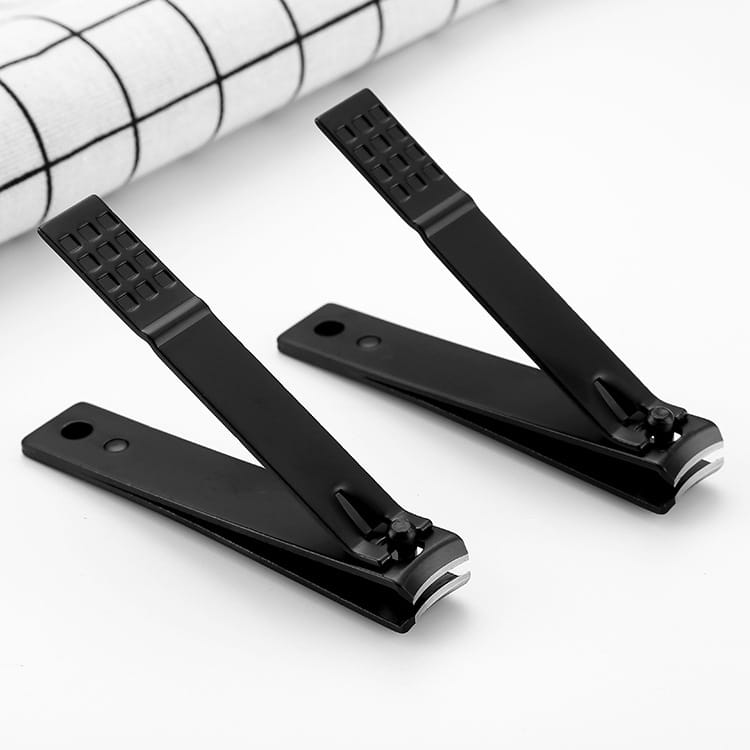 Black stainless steel nail clippers with textured grip handles and metallic cutting edges.
