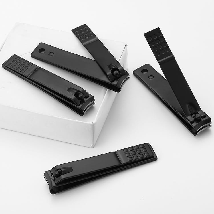 Set of black stainless steel nail clippers with textured grip handles for precise nail trimming.