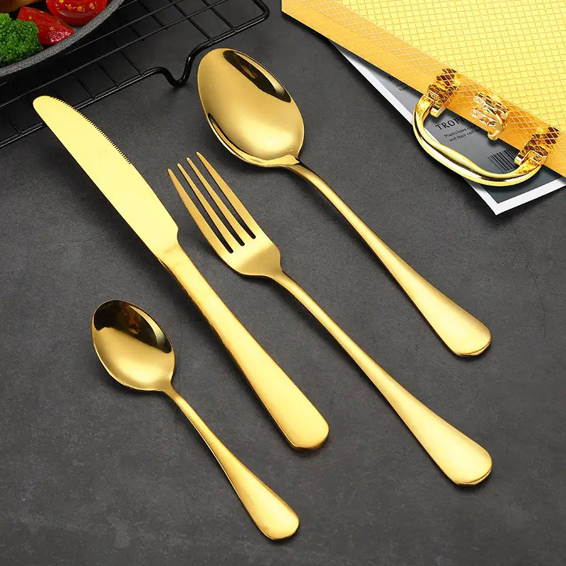 Gold stainless steel cutlery set 24 piece tableware featuring a sleek modern design with polished handles and reflective surfaces.