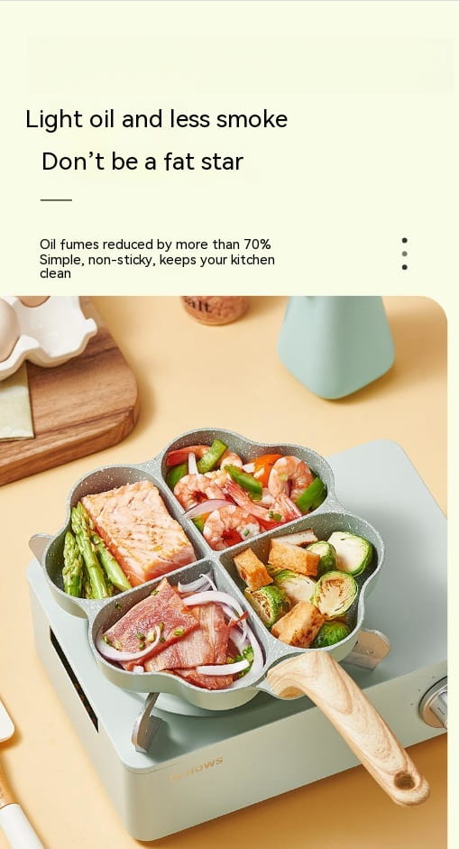 A light green nonstick four compartment egg frying pan with a wooden handle and heart-shaped sections.