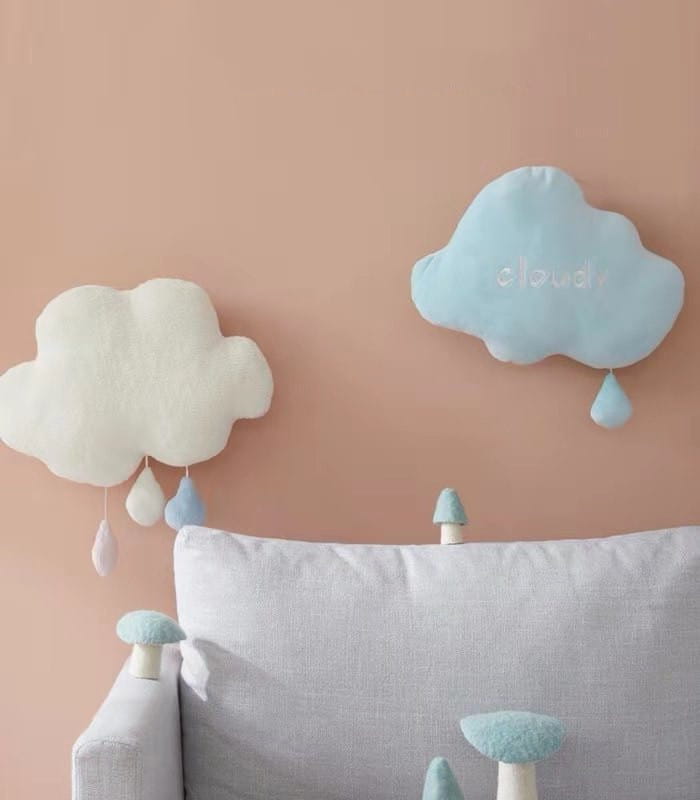 Soft pastel blue cloud-shaped plush wall hanging decor with embroidered cloud text and dangling raindrop accents.