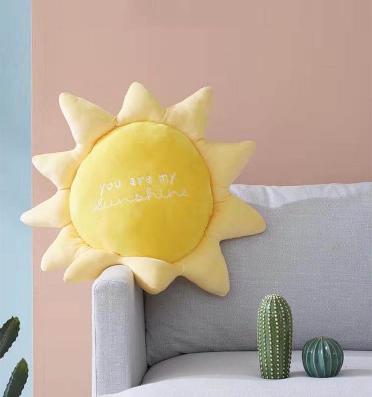 a soft yellow plush sun-shaped pillow embroidered with the phrase you are my sunshine featured in the cloud sun rainbow plush wall hanging decor collection