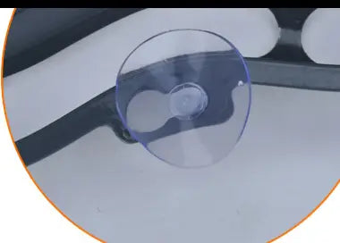 Clear circular suction cup with central hole and two smaller cutouts for secure attachment to smooth surfaces in cat track ball toy with suction cup.