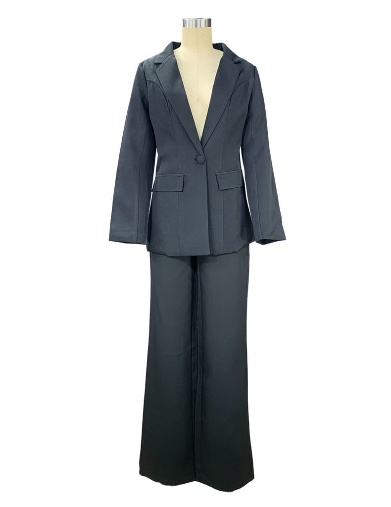 Dark gray women’s tailored blazer and wide leg trouser suit set featuring a structured fit in a formal fabric.