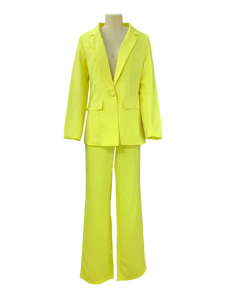 Bright neon yellow women’s tailored two-piece suit set featuring a blazer and wide leg flared trousers.