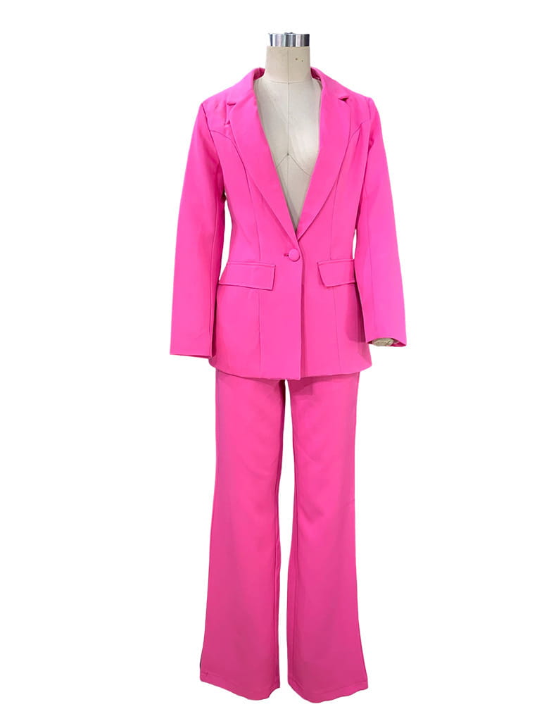 Bright fuchsia women’s tailored two-piece suit set featuring a fitted blazer and flared wide leg trousers.
