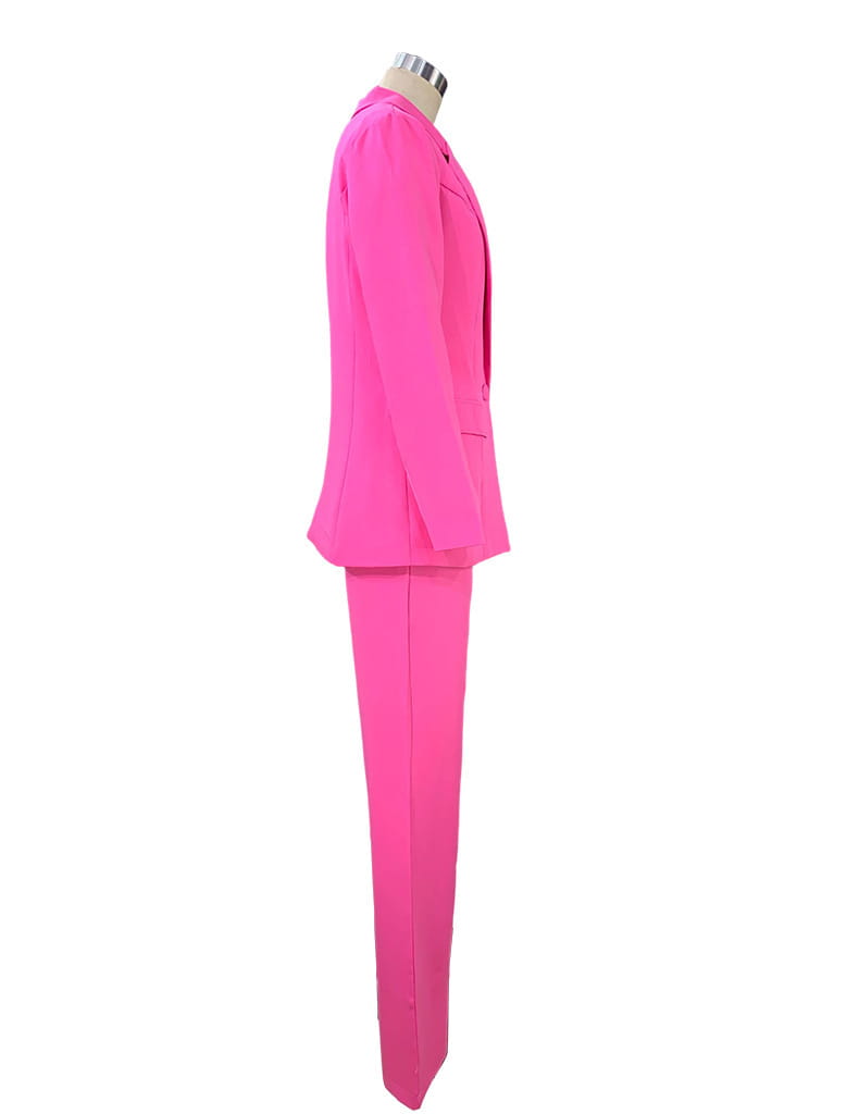 Bright pink tailored women’s two-piece suit set featuring a blazer and wide leg trousers displayed on a mannequin.