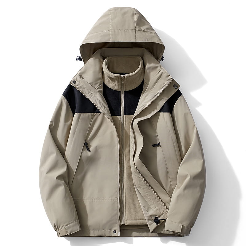 Chaqueta de caparazón impermeable 3 en 1 para parejas color beige y negro con caparazón exterior repelente al agua, capa interior forrada con forro polar, capucha y puños ajustables.