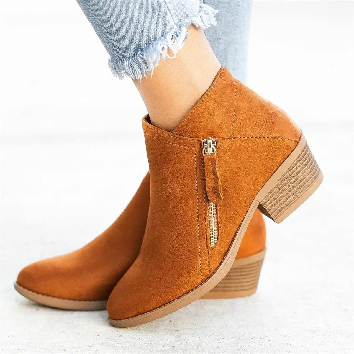 tan suede ankle boots with a low chunky heel and gold side zipper from dr martens