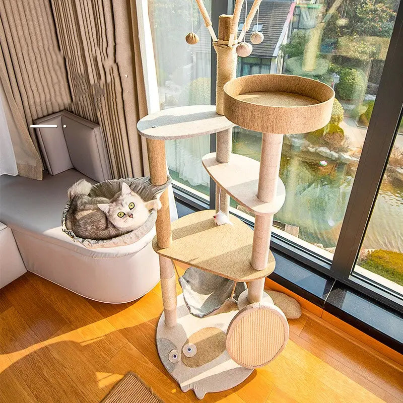 Large wooden cat tree climbing frame with beige and light brown multi-level platforms sisal posts and a cartoon owl base for scratching and playing.