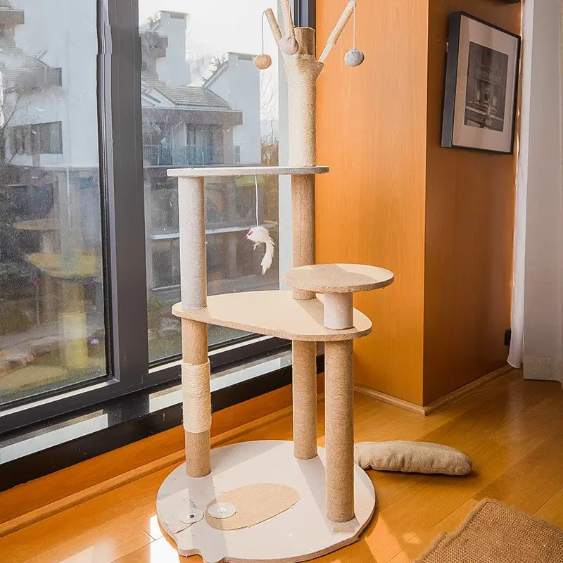 Beige and white large wooden cat tree climbing frame with sisal-wrapped posts, multi-level wooden platforms, and hanging toys for interactive cat play.