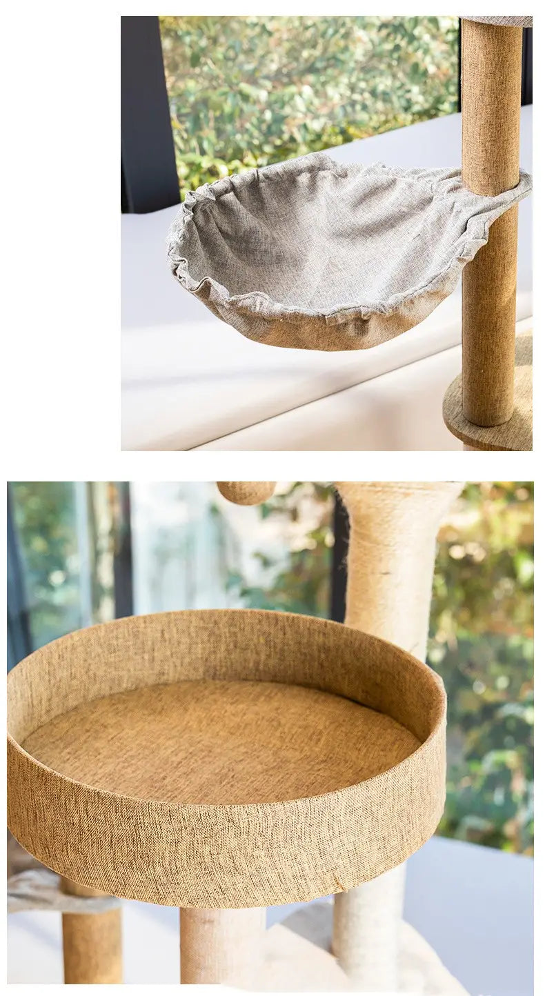 gray fabric hammock with ruffled edges suspended on a large wooden cat tree climbing frame with sisal posts.