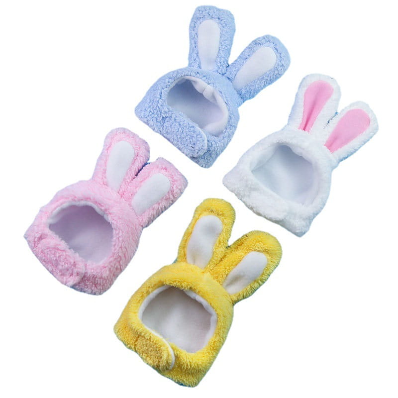 plush bunny ear pet hats featuring fluffy pastel blue pink white with pink inner ears and yellow ears designed as comfortable headbands.