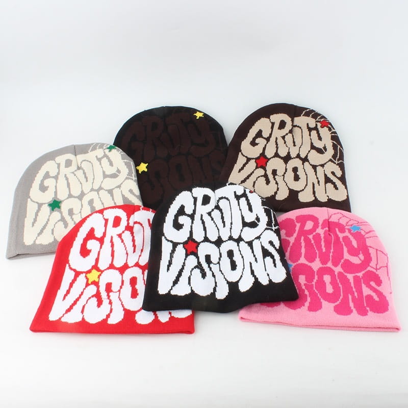 colorful knitted letter jacquard beanie hats in various hues featuring grit visions lettering and star accents.