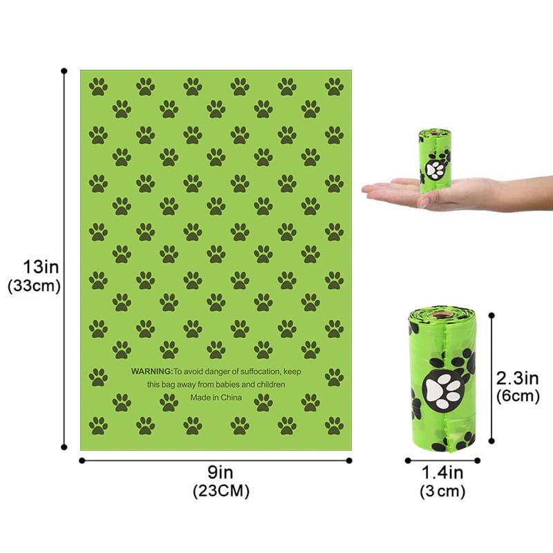Bright green disposable dog poop bags with black paw print patterns included with dispenser and refill rolls for pet waste management.