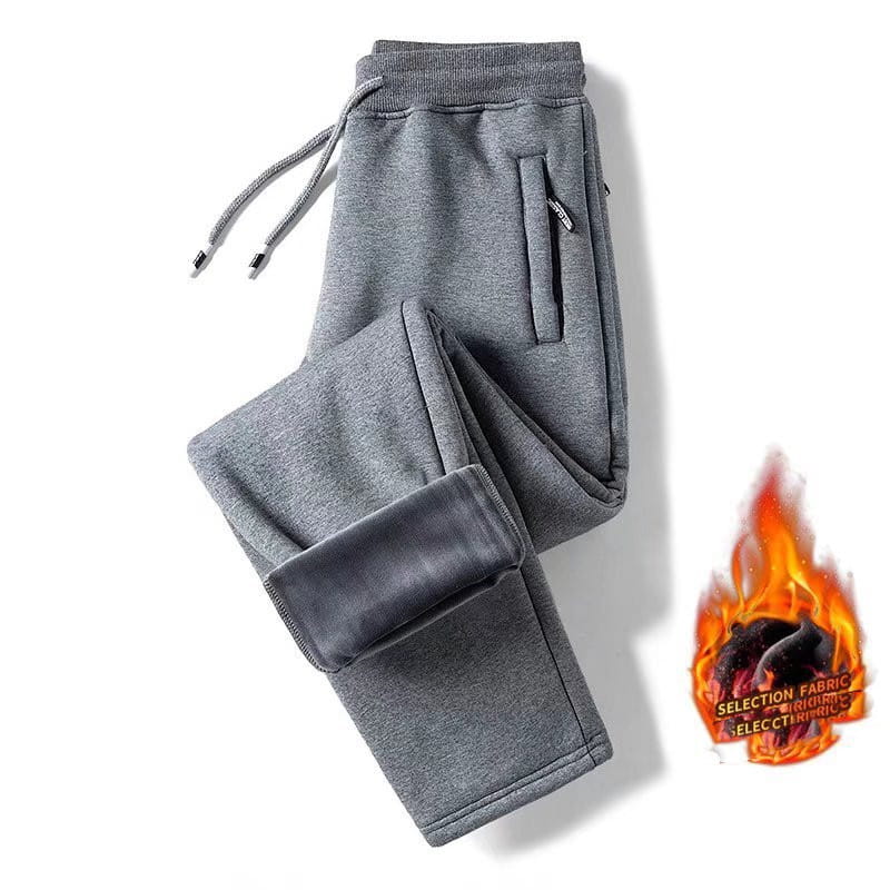 Gray fleece lined mens winter jogger pants featuring a drawstring waistband and side pockets made from soft fleece material for warmth and comfort.