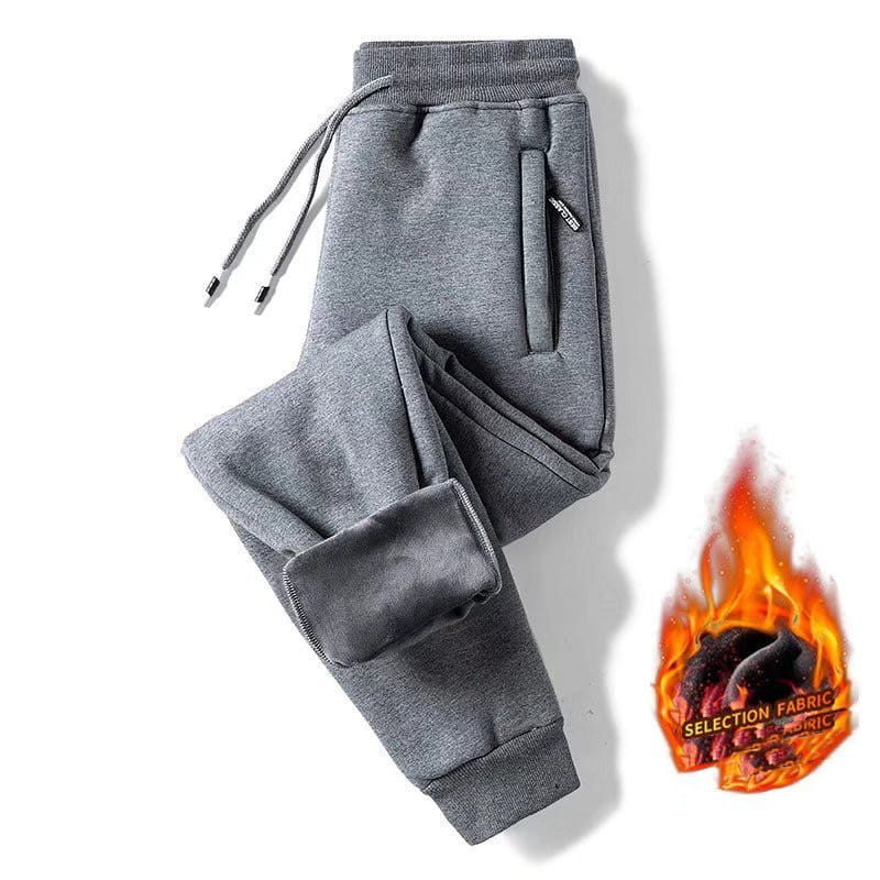 Gray fleece lined mens winter jogger pants with drawstring waistband ribbed cuffs and cozy interior lining highlighted by an illustrated flame graphic