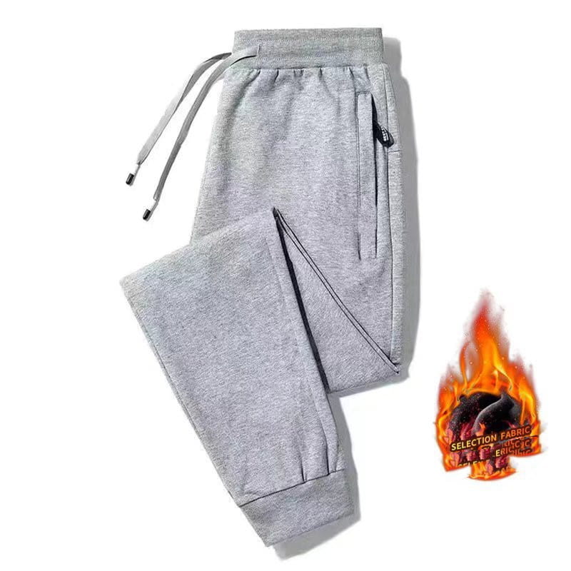 Fleece lined mens winter jogger pants in gray heathered fabric with black drawstrings, side pockets, and a cozy fleece lining for warmth.