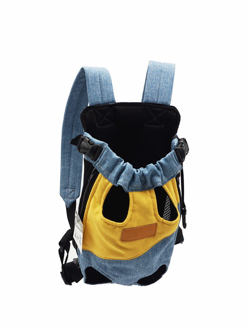 denim and yellow portable canvas pet backpack carrier with adjustable straps and mesh side panels for ventilation.