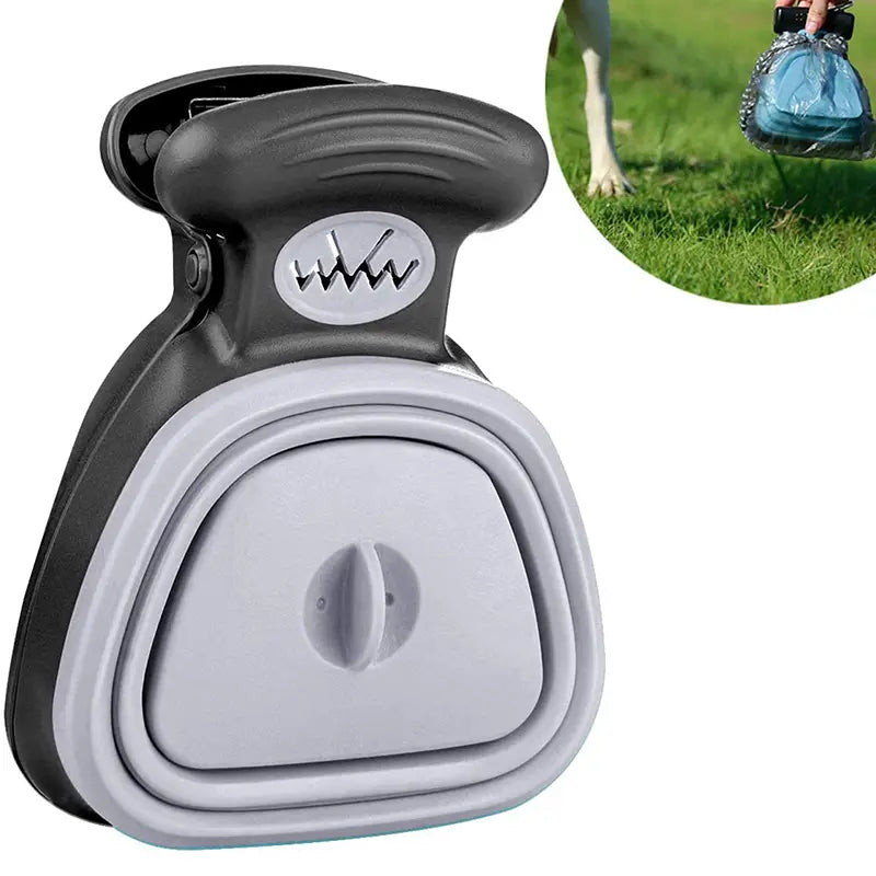 Gray and black plastic foldable dog poop bag dispenser with waste scooper featuring a collapsible design for convenient waste pickup.