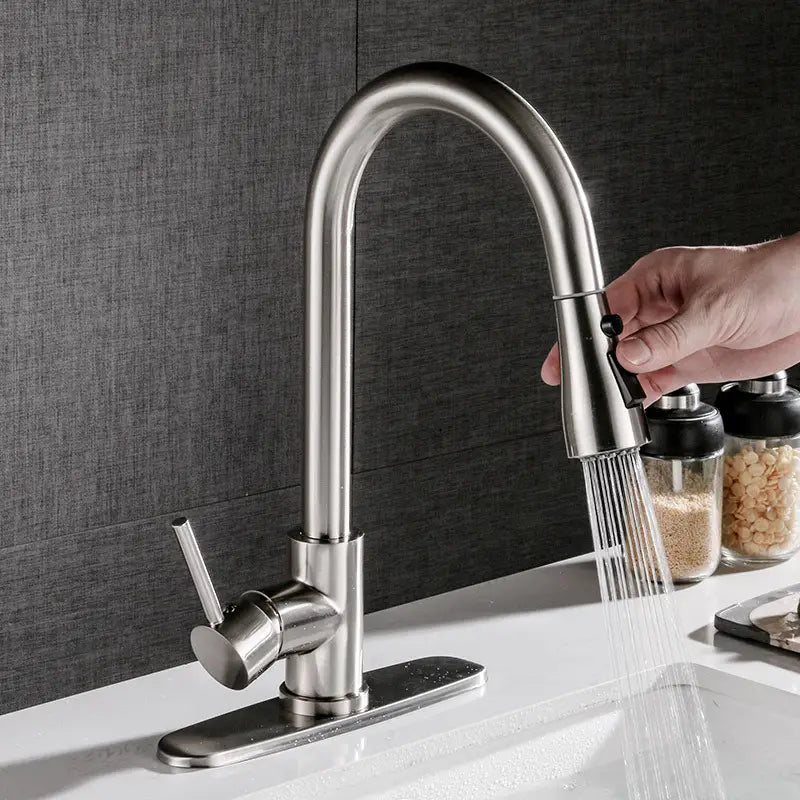 Brushed copper pull out kitchen faucet in stainless steel with a sleek arched spout and single lever handle designed for modern kitchen use.