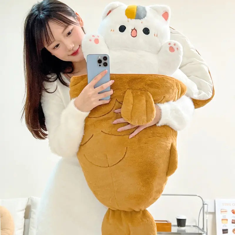 a plush animal pillow radish rabbit and cat toy featuring a white upper body with black eyes and pink cheeks, a yellow and gray patch on the head, and a tan lower body resembling a fish or whale.