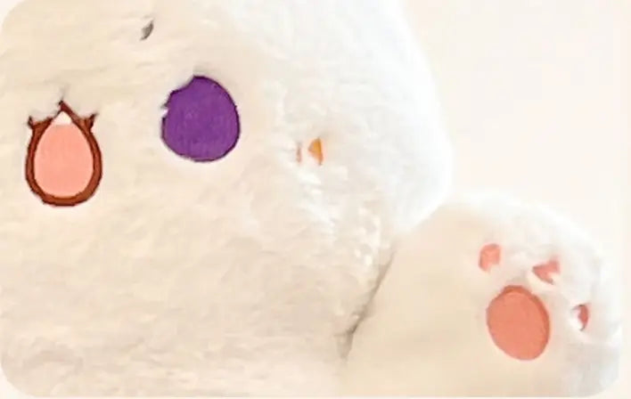 white plush animal pillow radish rabbit and cat toy with embroidered pink and purple paw prints made of soft fabric.