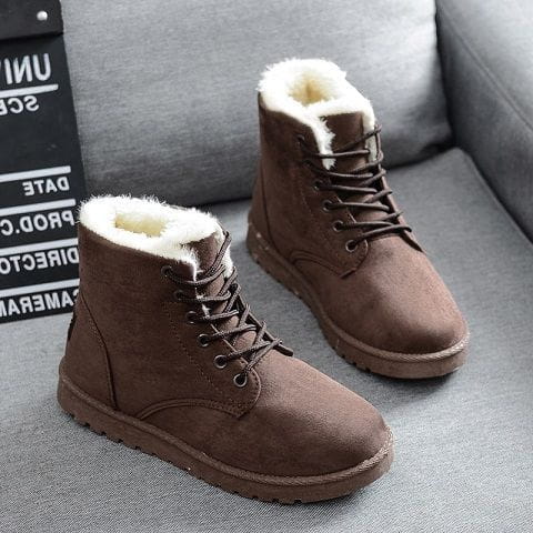 Martin boots women suede fur lined winter shoes in brown with white fluffy lining and dark brown laces.