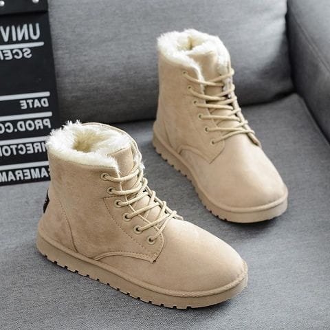 Beige suede ankle martin boots for women with plush white faux fur lining and matching laces designed for winter use.