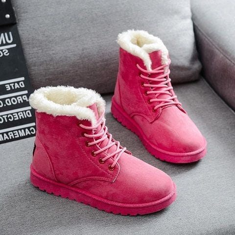 pink suede ankle martin boots for women with white faux fur lining and matching laces designed as winter shoes