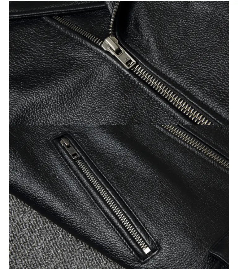 Men’s cowhide leather motorcycle biker jacket in black featuring silver zippers and lapels.
