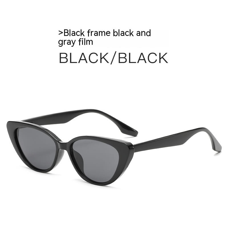 Schwarze Retro-Chic-Cat-Eye-Sonnenbrille mit schlankem glänzendem Gestell und grauen getönten Gläsern.