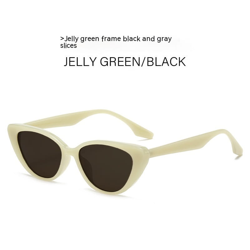 Retro-Chic-Cat-Eye-Sonnenbrille mit Jelly-Green-Gestell, schwarzen und grauen Einsätzen sowie getönten Gläsern.