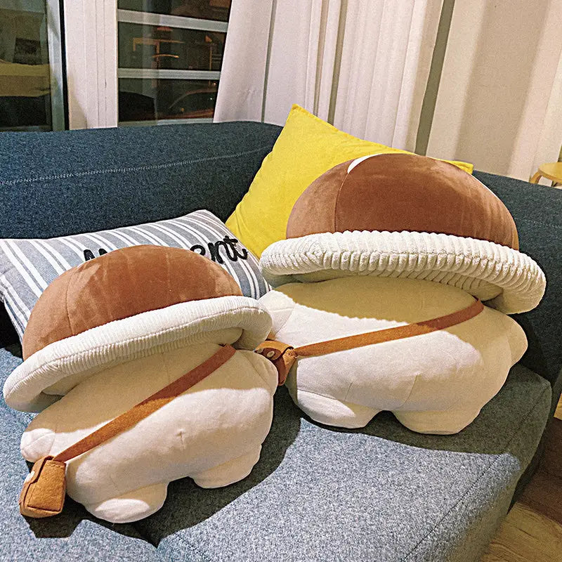 Cute brown and cream-colored mushroom plush pillow with ribbed white cap and tan straps made of corduroy fabric for decorative and comfort use.