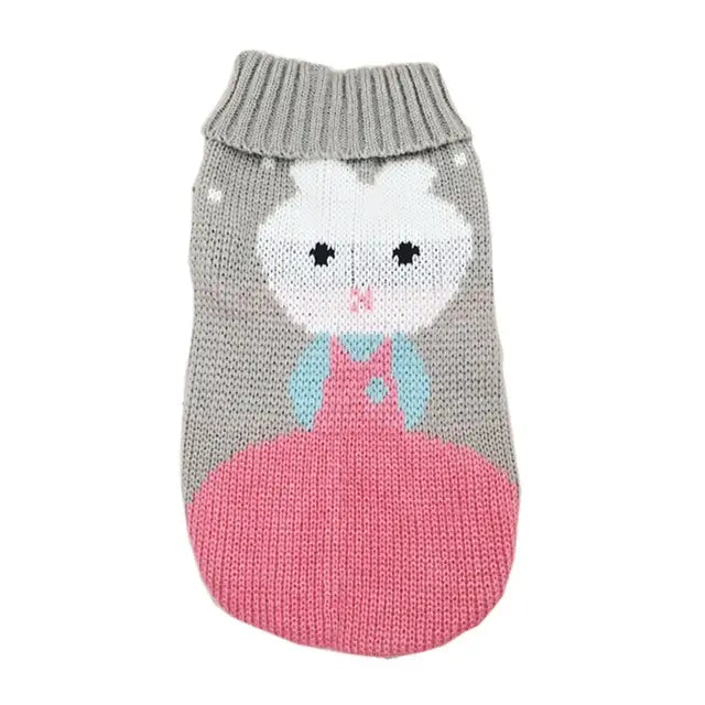 Gray knitted dog sweater featuring a white bunny with black eyes and pink nose wearing light blue overalls and a pink skirt for festive winter pet apparel.