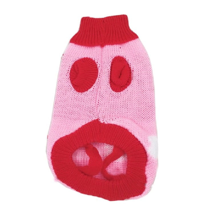 Pink knitted dog sweater with red accents featuring a pig face design for festive winter pet apparel.