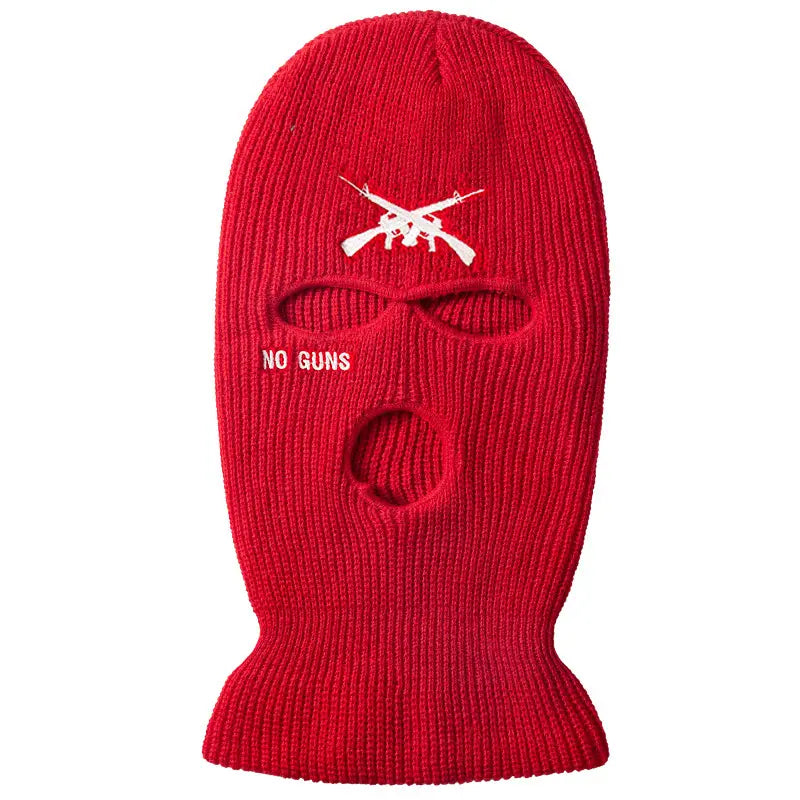 Red knitted windproof balaclava with white embroidered crossed rifles and no guns text for skiing and outdoor use.