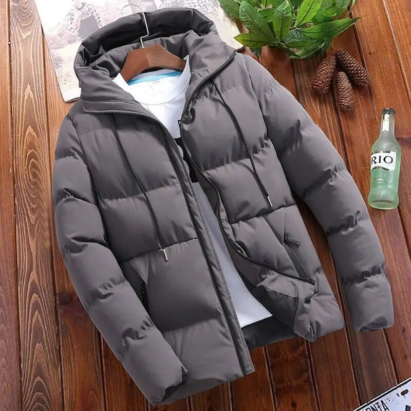Men’s quilted cotton hooded puffer jacket in gray with black drawstrings featuring quilted panels and front zipper closure.