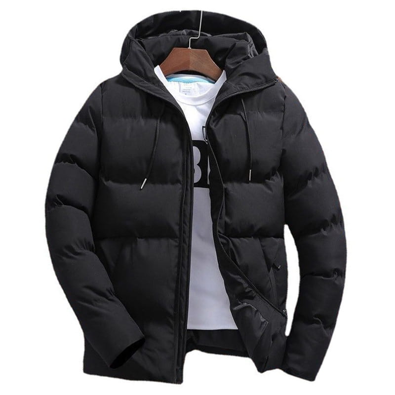 Black quilted cotton men’s puffer jacket with hood hanging on a wooden hanger.