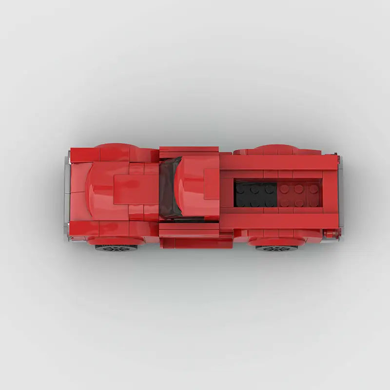 Ensemble de jouets par blocs de construction de camionnette ancienne rouge, avec un modèle LEGO rouge, un habitacle noir et des accents argentés.