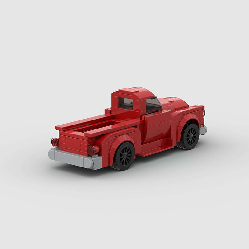 Ensemble de jouets par blocs de construction de camionnette ancienne rouge, avec une camionnette LEGO rouge, des roues noires et un pare-chocs gris.