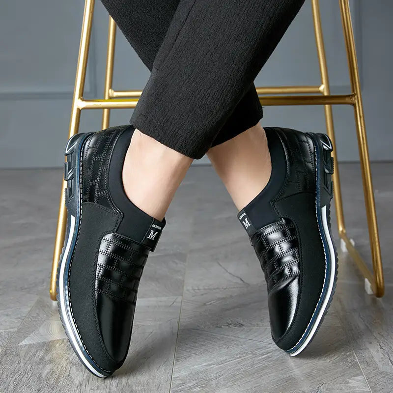 black leather slip-on shoes for men featuring a textured pattern and white rubber soles suitable for casual wear in large sizes