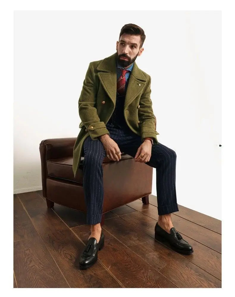 black leather tassel loafers paired with an olive green wool double-breasted coat for a classic formal look
