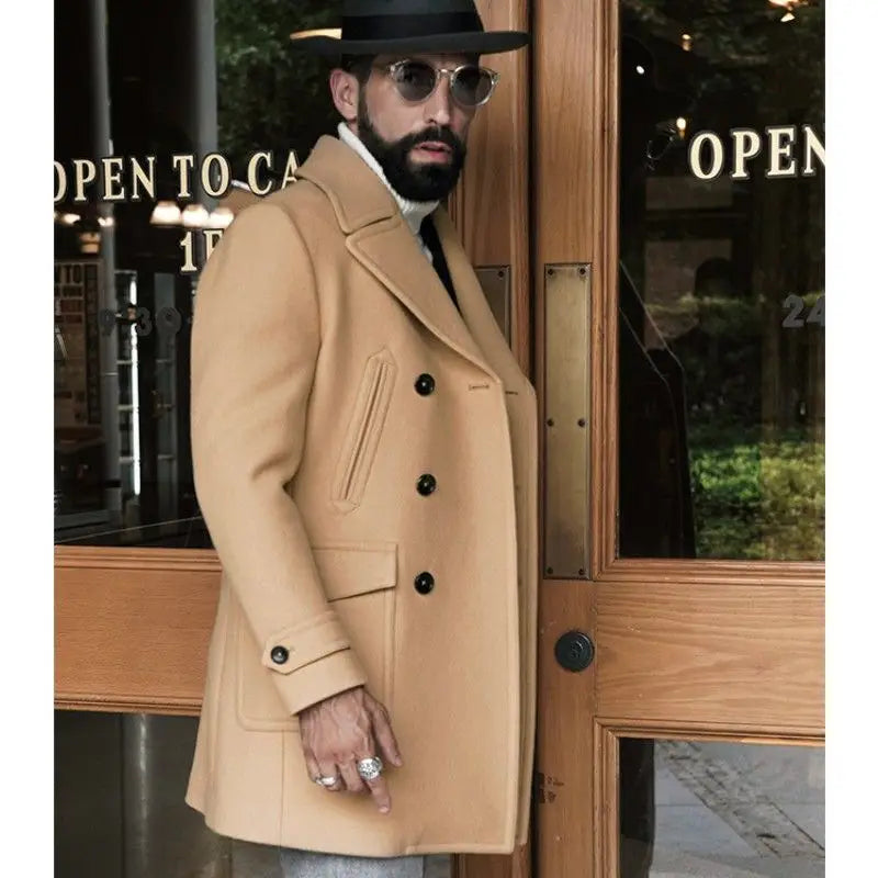 A tan wool double-breasted coat with black buttons and flap pockets in the style of an olive green wool double-breasted coat.