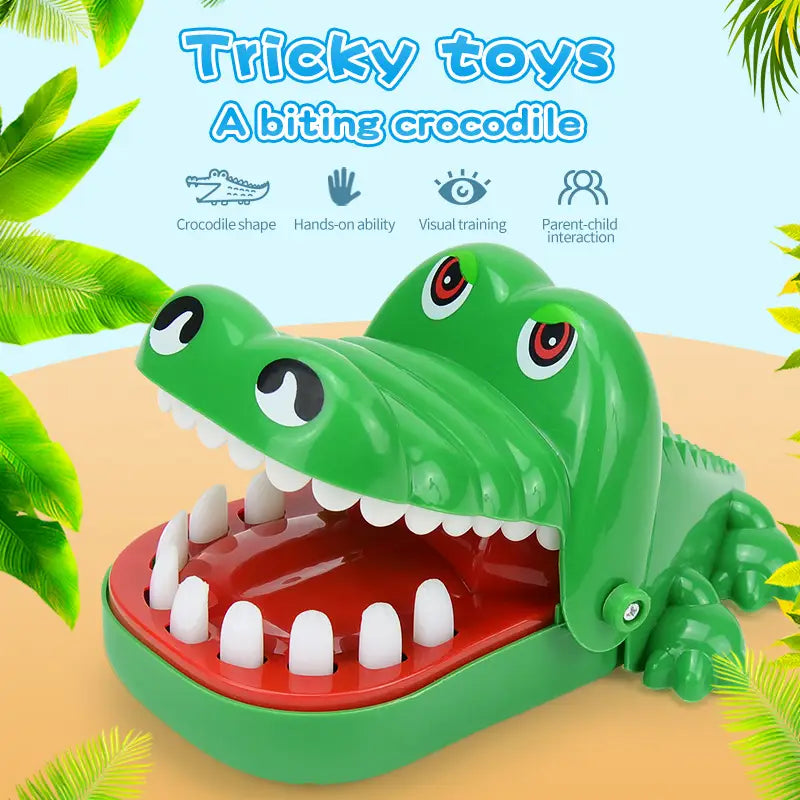 Green plastic crocodile biting finger game toy with red interior and white teeth for interactive kids play.