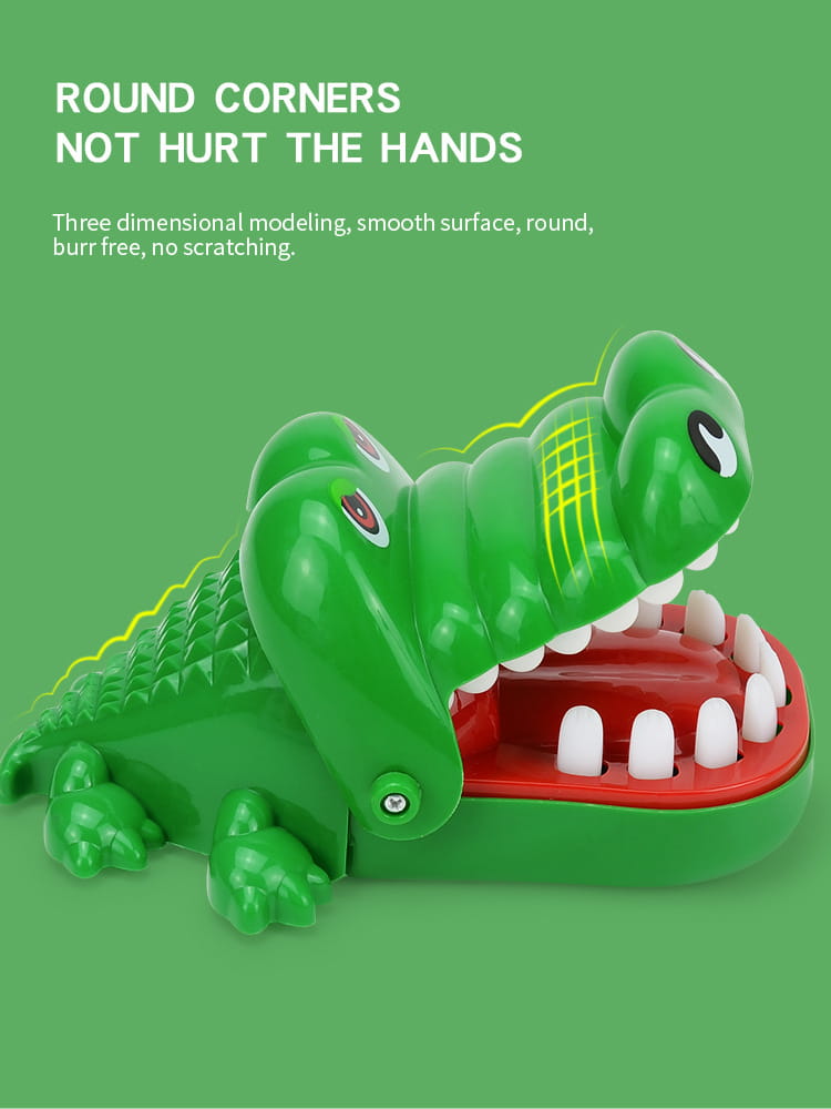 green plastic crocodile biting finger game interactive kids toy with red interior mouth and white teeth