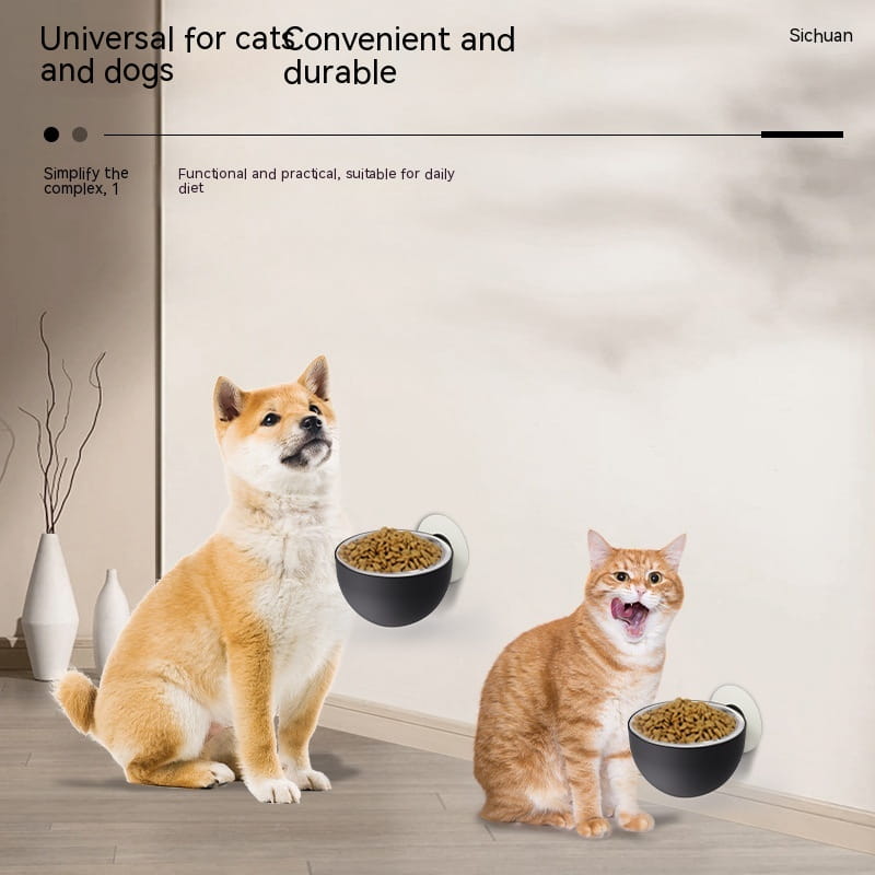 Black stainless steel magnetic wall mounted pet food bowls with white suction cups attached to a wall.