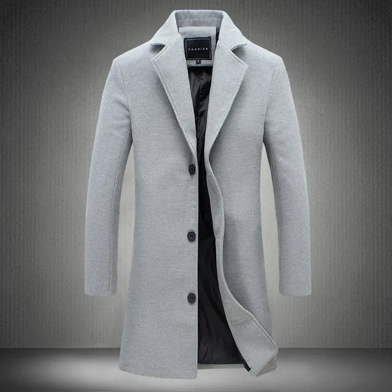 Men’s solid wool blend casual business overcoat in light gray with black buttons and contrasting black inner lining.