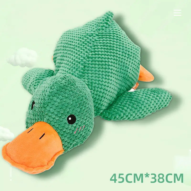 A plush green duck dog toy with an orange beak and feet made from textured fabric designed as a bite resistant molar chew toy.